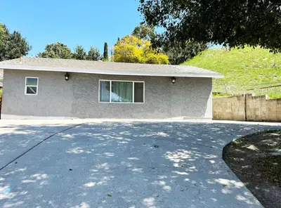 a house with a driveway in front of it at Uniktrend Campo Rd Home by SD Stay in Spring Valley