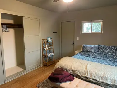 a bedroom with a bed and a large mirror at 2BR Cozy Quiet Getaway, Great Mattress in El Cajon