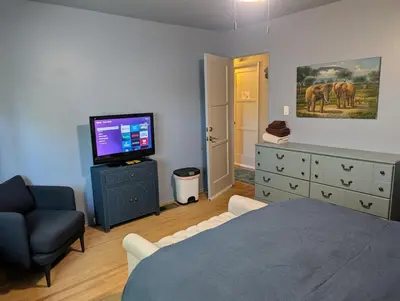 a bedroom with a bed and a television and a dresser at 2BR Cozy Quiet Getaway, Great Mattress in El Cajon