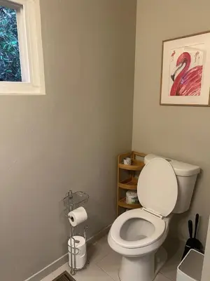 a bathroom with a white toilet and a window at 2BR Cozy Quiet Getaway, Great Mattress in El Cajon