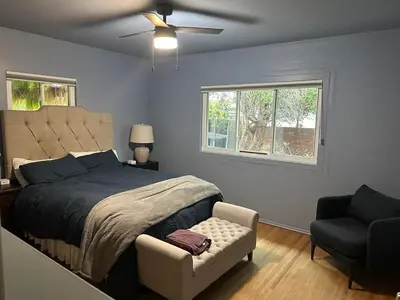 a bedroom with a bed and a chair and a window at 2BR Cozy Quiet Getaway, Great Mattress in El Cajon