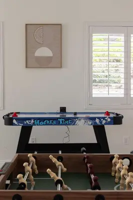 a ping pong table with puppets on top of it at Spacious Central Home Villa in San Diego