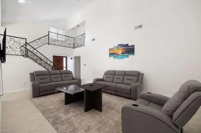 a living room with two couches and a table at Spacious Central Home Villa in San Diego