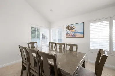 a dining room with a table and chairs at Spacious Central Home Villa in San Diego
