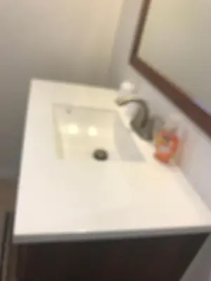 a white sink in a bathroom with a mirror at La Jolla private Studio in San Diego