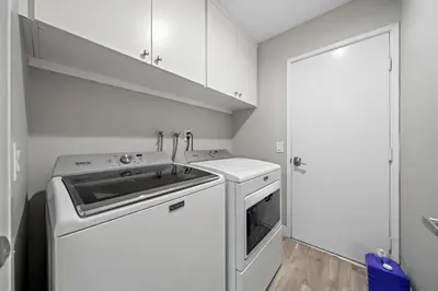 a white kitchen with a stove and a dishwasher at Entire Private Home with 3 Bedrooms 2 Bathrooms, Gated Yard, Garage, Hot Tub, 4-Beds, Golf, Mira Mesa, Available Now in San Diego