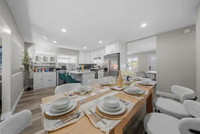 a kitchen and dining room with a table and chairs at Entire Private Home with 3 Bedrooms 2 Bathrooms, Gated Yard, Garage, Hot Tub, 4-Beds, Golf, Mira Mesa, Available Now in San Diego