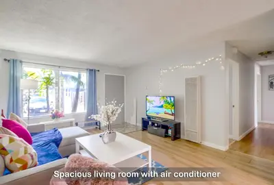 a living room with a couch and a tv at Entire Private Home with 3 Bedrooms 2 Bathrooms, Ranch Style w Gated Yard near Beach, Available Now in Imperial Beach