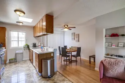 a kitchen and living room with a table and chairs at Entire Private Home with 3 Bedrooms 2 Bathrooms, Ranch Style w Gated Yard near Beach, Available Now in Imperial Beach