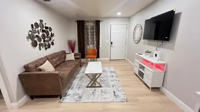 a living room with a couch and a tv at 321 W Park El Cajon Front Unit by SD Stay in El Cajon