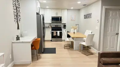 a kitchen and dining room with a table and a refrigerator at 321 W Park El Cajon Front Unit by SD Stay in El Cajon