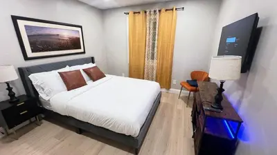 a bedroom with a bed and a table with a lamp at 321 W Park El Cajon Front Unit by SD Stay in El Cajon