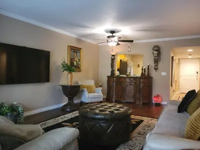 a living room with a couch and a tv at Outstanding condo with great amenities in La Mesa