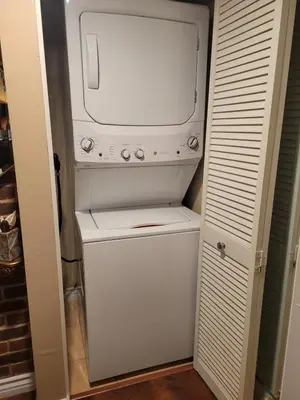 a white washer and dryer in a closet at Outstanding condo with great amenities in La Mesa