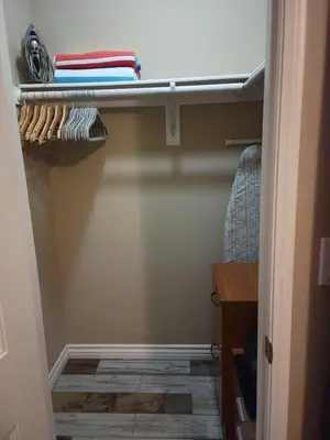 a closet with a shelf and some towels on it at Outstanding condo with great amenities in La Mesa