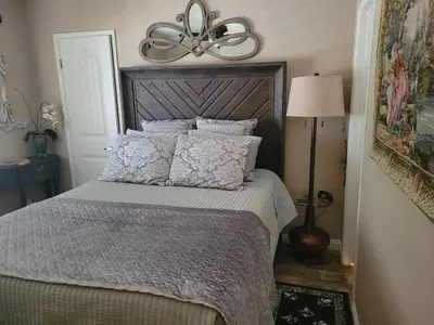 a bedroom with a bed with a ceiling fan at Outstanding condo with great amenities in La Mesa
