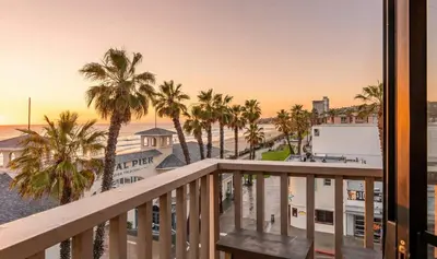 a view of the beach from the balcony of a resort at Pier-View Penthouse Condo in Pacific Beach in San Diego