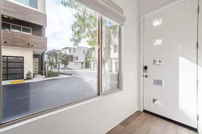 an empty room with a large window and a door at #Marbella Lane - Luxurious Coastal Haven Escape in Newport Beach