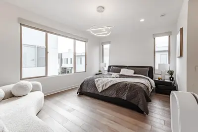 a white bedroom with a bed and a couch at #Marbella Lane - Luxurious Coastal Haven Escape in Newport Beach