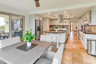 a kitchen and dining room with a table and chairs at Game Room, Hot Tub and Views! Luxe Temecula Estate in Temecula