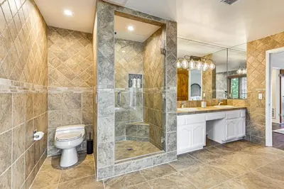 a bathroom with a toilet and a shower at Game Room, Hot Tub and Views! Luxe Temecula Estate in Temecula