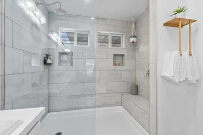 a bathroom with a shower with a tub and a sink at Avocado Akres Awaits Near Monserate Winery in Fallbrook
