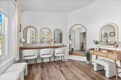 a dressing room with mirrors and a table and chairs at Avocado Akres Awaits Near Monserate Winery in Fallbrook