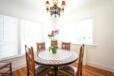 a dining room table with chairs and a chandelier at 4 Bdr 2 Bth in heart of Hilcrest 10 minutes from balboa park in San Diego