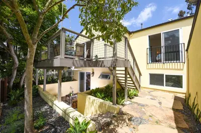 a house with a balcony and a staircase at 4 Bdr 2 Bth in heart of Hilcrest 10 minutes from balboa park in San Diego