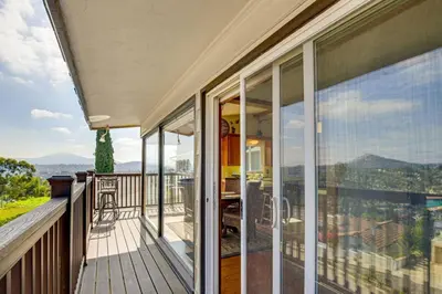 a balcony of a house with a view of the mountains at 474 Oasis w Amazing Views Huge Pool in La Mesa
