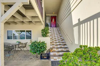 a staircase leading to a house with a table and chairs at 474 Oasis w Amazing Views Huge Pool in La Mesa