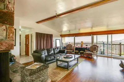 a living room with a couch and a table at 474 Oasis w Amazing Views Huge Pool in La Mesa
