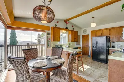a kitchen with a table and chairs in a kitchen at 474 Oasis w Amazing Views Huge Pool in La Mesa
