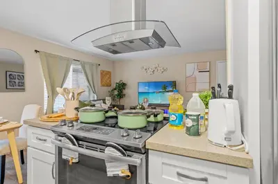 a kitchen with green pots and pans on a stove at Entire Private Home with 2 Bedrooms 1 Bathroom, King Bed, Pool, Hot Tub, 2 Parking in Mira Mesa Available Now in San Diego