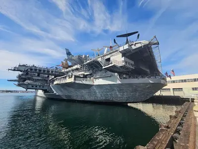 a large cruise ship is docked in the water at Entire Private Home with 2 Bedrooms 1 Bathroom, King Bed, Pool, Hot Tub, 2 Parking in Mira Mesa Available Now in San Diego