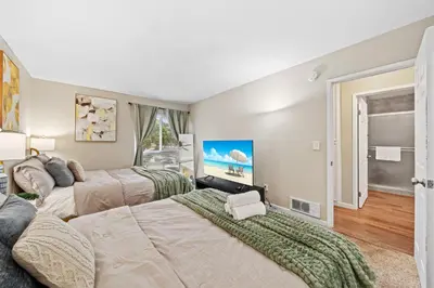 a bedroom with two beds and a window at Entire Private Home with 2 Bedrooms 1 Bathroom, King Bed, Pool, Hot Tub, 2 Parking in Mira Mesa Available Now in San Diego