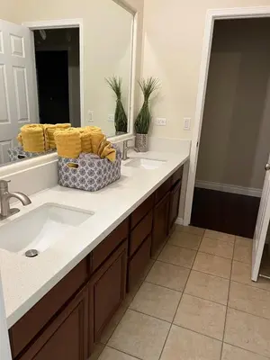 a bathroom with a sink and a mirror at Modern Family Oasis in San Jacinto