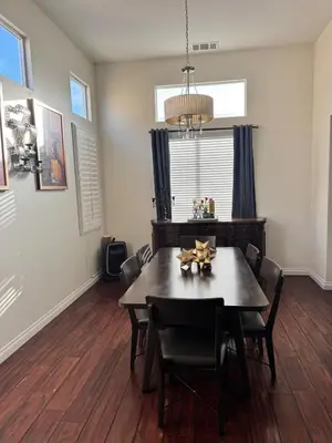 a dining room with a table and chairs at Modern Family Oasis in San Jacinto