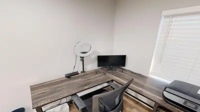 a room with a desk with a mirror and chairs at Spacious 4BR Loft - Outdoor Movie Theater in El Cajon