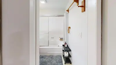 a bathroom with a tub and a shower at Spacious 4BR Loft - Outdoor Movie Theater in El Cajon