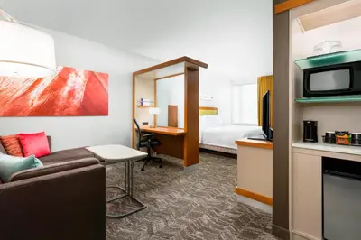a hotel room with a couch and a bed at SpringHill Suites by Marriott San Diego Mission Valley in San Diego