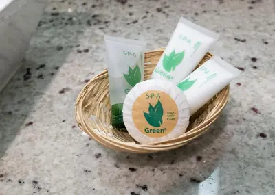 a basket of spa green products sitting on a counter at Scandia Motel in Carlsbad