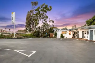a parking lot in front of a building at Scandia Motel in Carlsbad