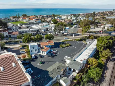 an aerial view of a town with the ocean at Scandia Motel in Carlsbad