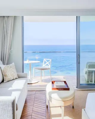 a living room with a view of the ocean at Surf & Sand Laguna Beach in Laguna Beach