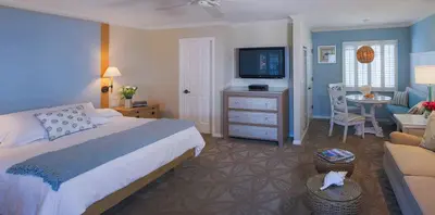 a bedroom with a bed and a living room at Scripps Inn in San Diego