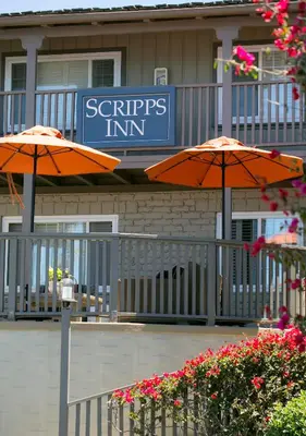 two orange umbrellas in front of a hotel at Scripps Inn in San Diego