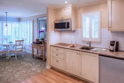a kitchen with a sink and a table at Scripps Inn in San Diego