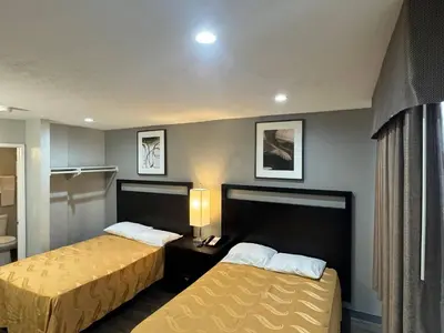 a hotel room with two beds in a room at Rodeway Inn El Cajon - San Diego East in El Cajon