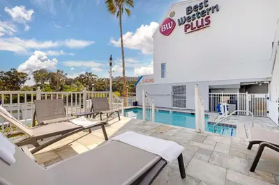a patio with chairs and a pool at a best western plus hotel at Best Western Plus Marina Shores Hotel in Dana Point